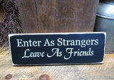 Enter As Strangers Leave As Friends, Front Door Sign