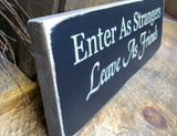 Enter As Strangers Leave As Friends, Front Door Sign